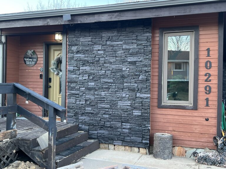 A home exterior accent wall using GenStone's Iron Ore Stone Veneer panels.