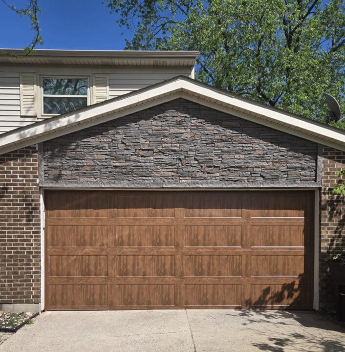 A DIY garage siding remodel project using GenStone's Coffee Faux Stone panels.