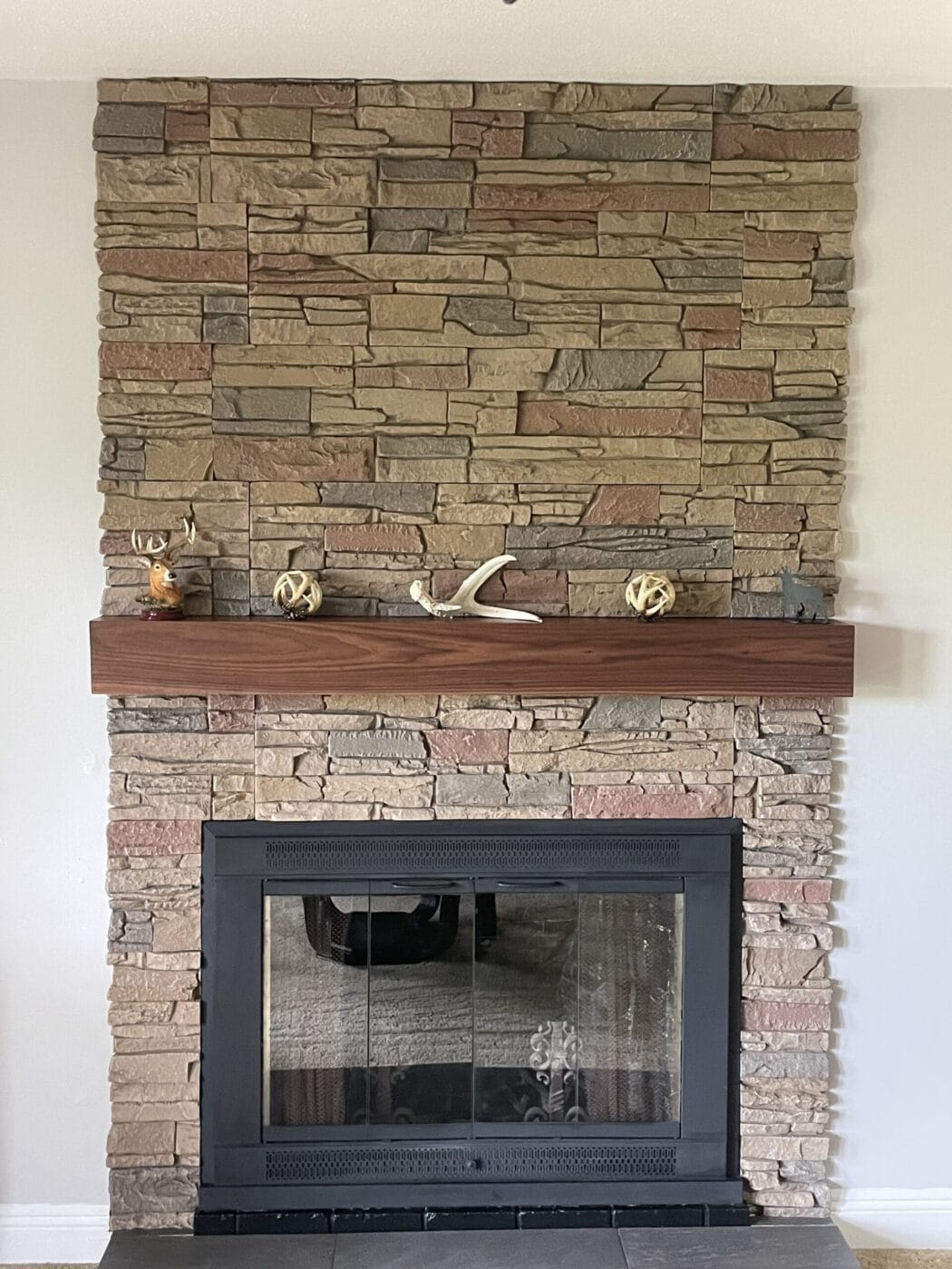 A fireplace surround project that uses GenStone's Desert Sunrise faux stone panels over brick.