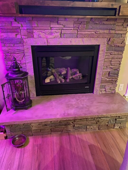 A custom gas fireplace design using GenStone's Desert Sunrise Stacked Stone panels.