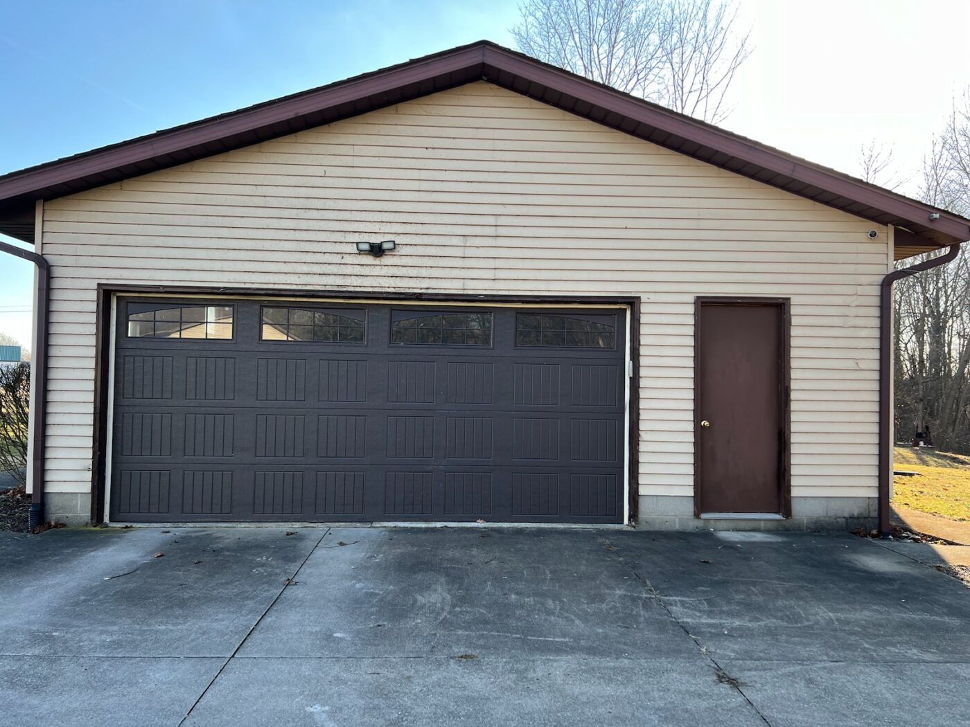 Before the installation of a DIY garage siding project made using GenStone's Kenai faux stone.