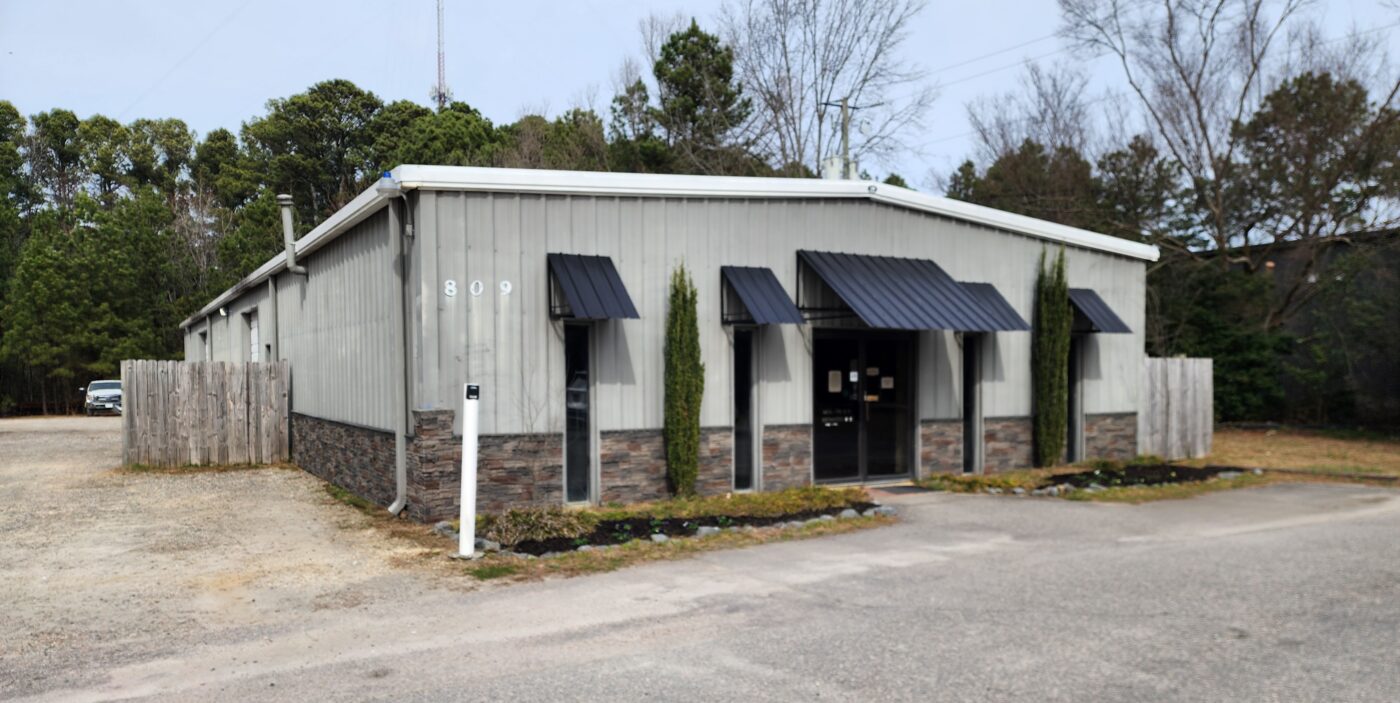 A DIY wainscoting project on a metal building made using GenStone's Kenai Stacked Stone panels.