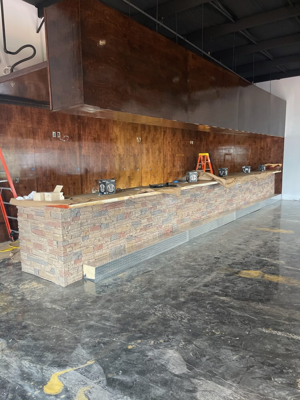 A DIY restaurant bar project made using GenStone's Desert Sunrise Stacked Stone.