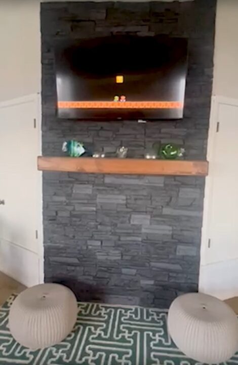 A DIY interior accent wall made using GenStone's Iron Ore Stacked Stone panels.