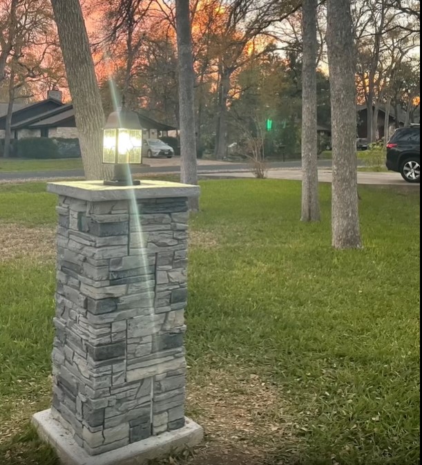 DIY lighted columns made using GenStone's Northern Slate faux stone panels.