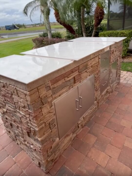 A DIY patio bar made using GenStone's Desert Sunrise faux stone panels.