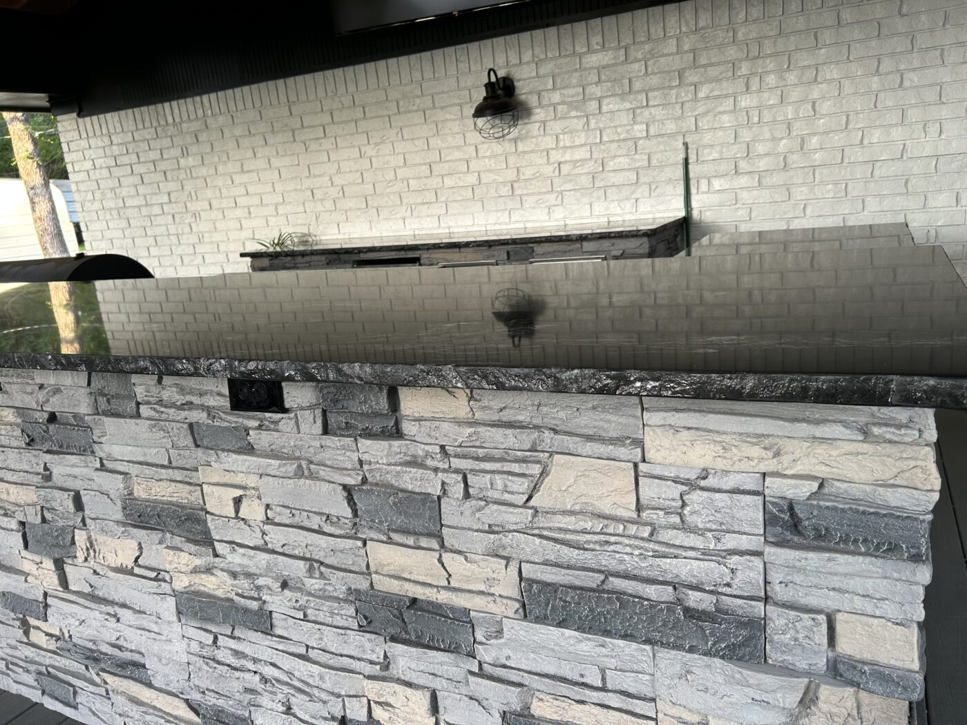 Chris used GenStone's Northern Slate Stacked Stone panels to create a beautiful outdoor kitchen.