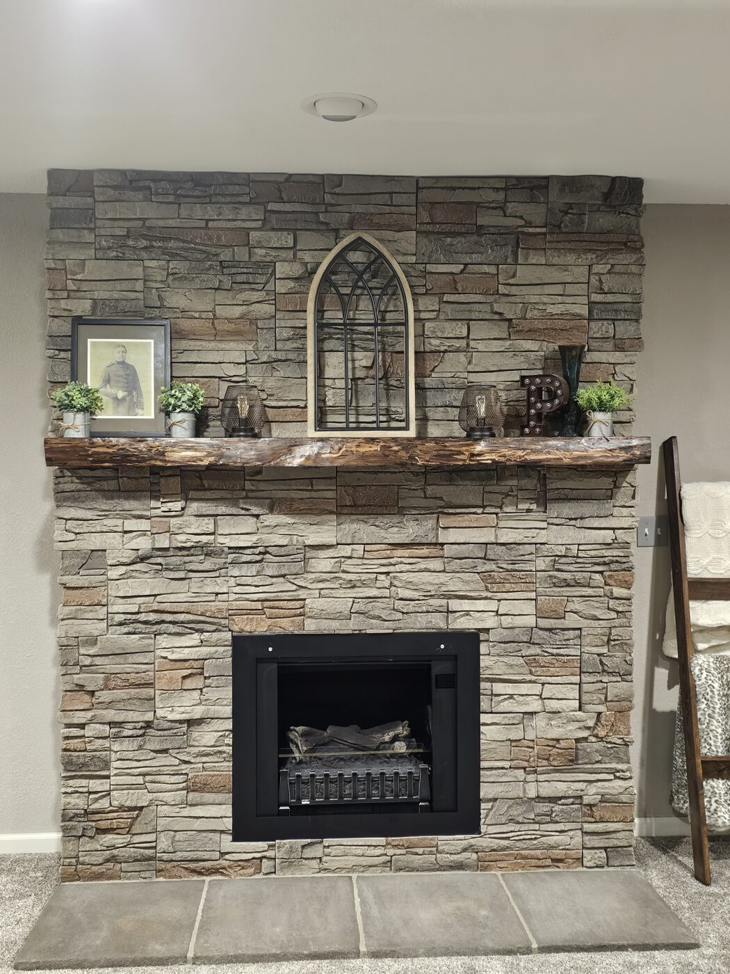Joellen created an imitation slate hearth using GenStone's Kenai Stacked Stone panels.