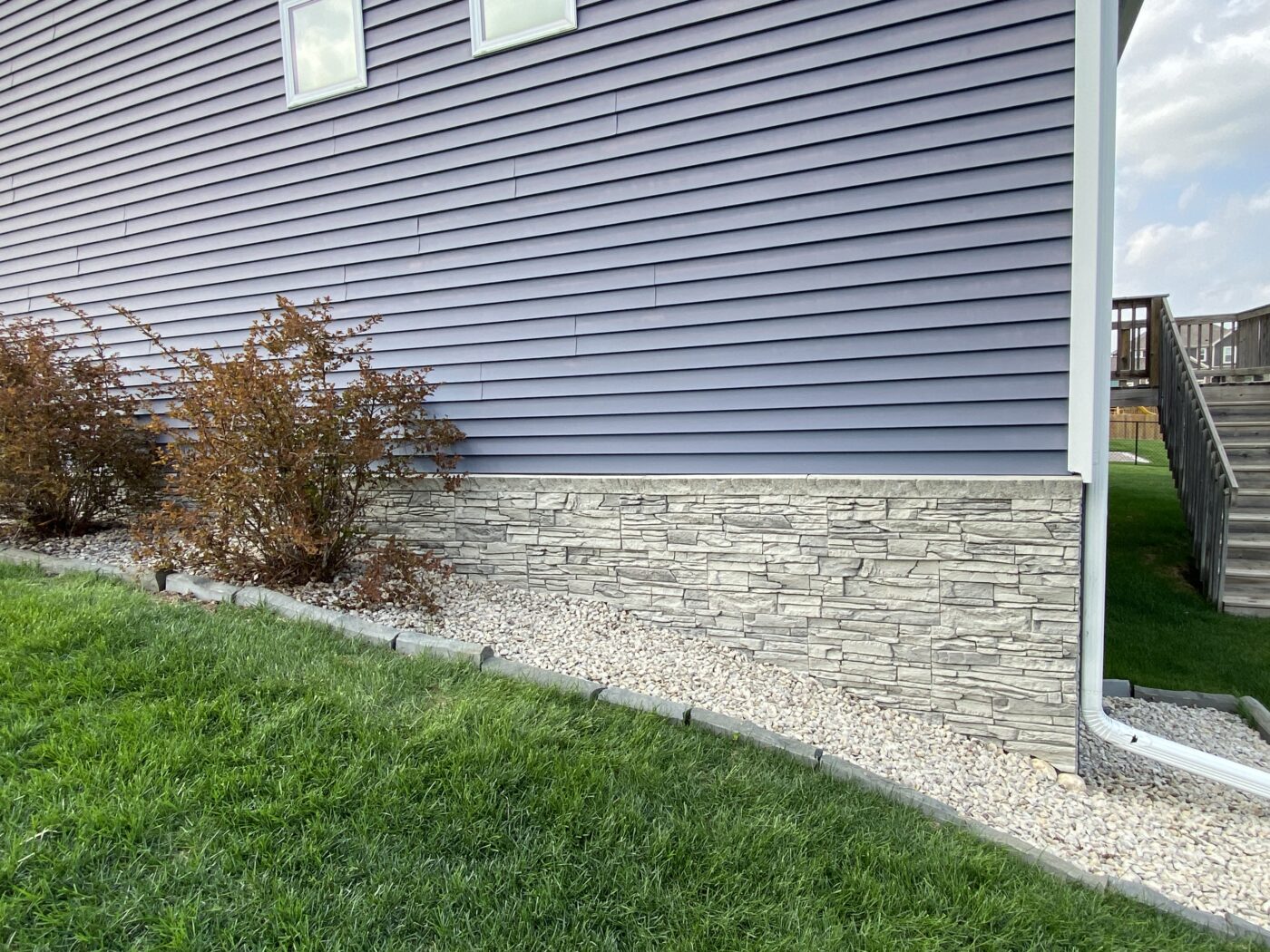 John created this light gray foundation cover using GenStone's Arctic Smoke Stacked Stone panels.