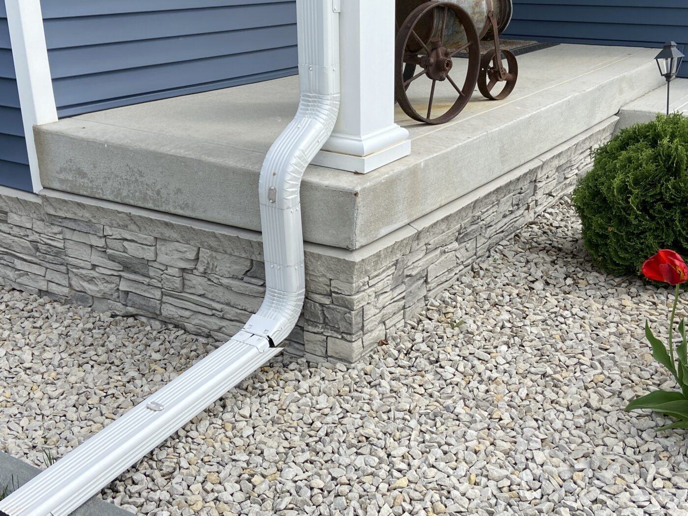 John's light gray foundation cover porch