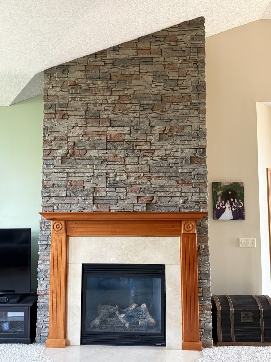 Stacy utilized GenStone's Kenai Stacked Stone panels to create a beautiful brown slate fireplace​.