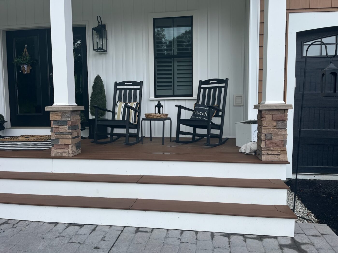 The slate porch pillars on this home's exterior were upgraded using GenStone's Desert Sunrise Stacked Stone Pillar panels.