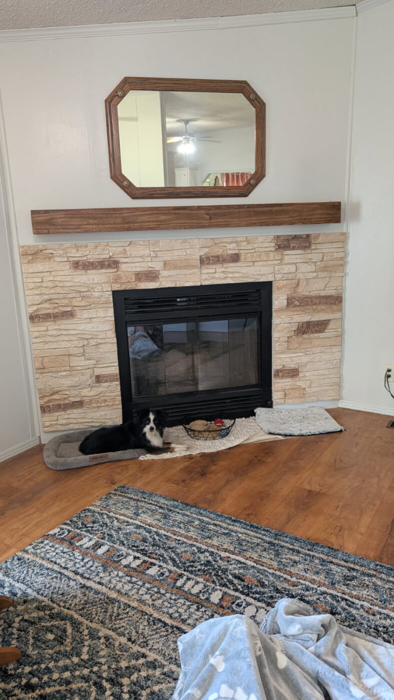 This is a beige stone fireplace that was created using GenStone's Vanilla Bean Stacked Stone panels.