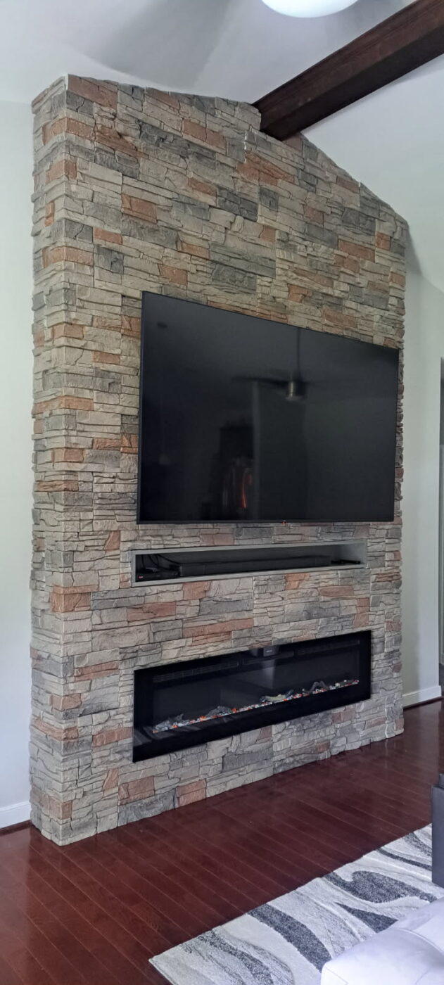 This DIY faux stone fireplace was created using GenStone's Kenai Stacked Stone panels.