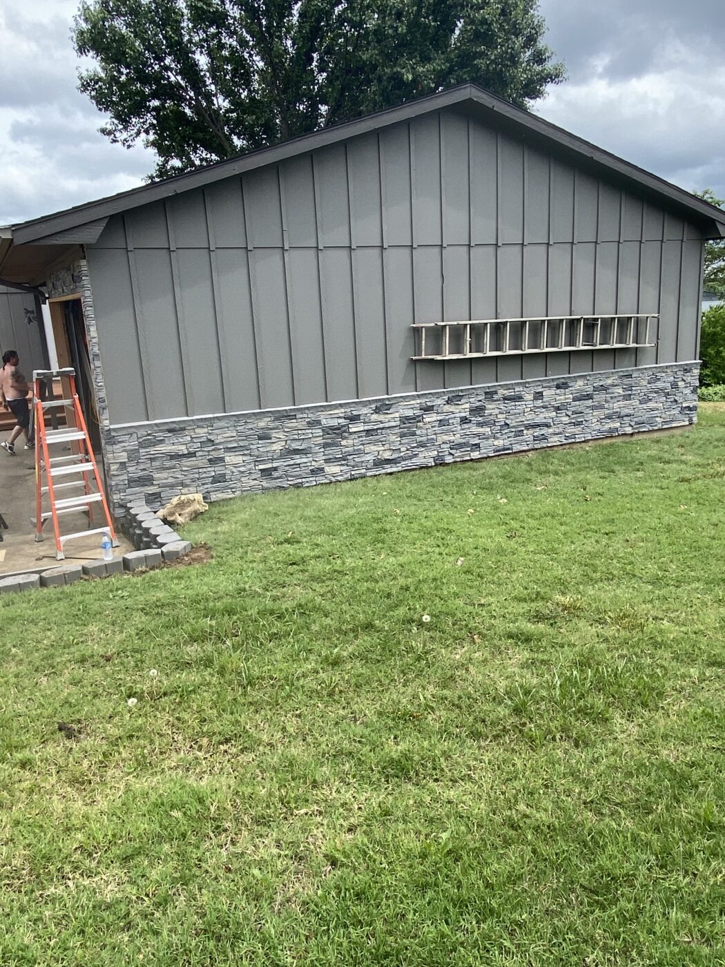 This home has a DIY slate wainscot that was created using GenStone's Northern Slate Stacked Stone panels.