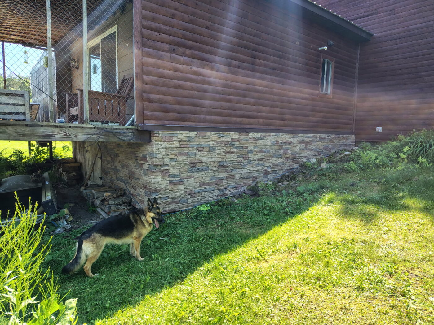 This cabin's foundation has been vastly improved after Marcia completed a cabin foundation cover up project using GenStone's Desert Sunrise Stacked Stone panels.