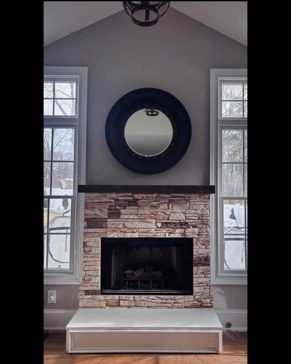 This light stone fireplace was designed using GenStone's Vanilla Bean Stacked Stone panels.