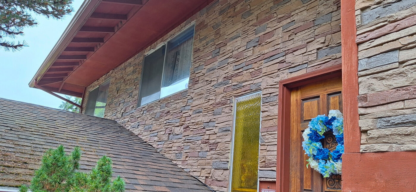 This home exterior was improved with the help of GenStone's Desert Sunrise Stacked Stone panels, giving the home a beautiful multi color stone siding.