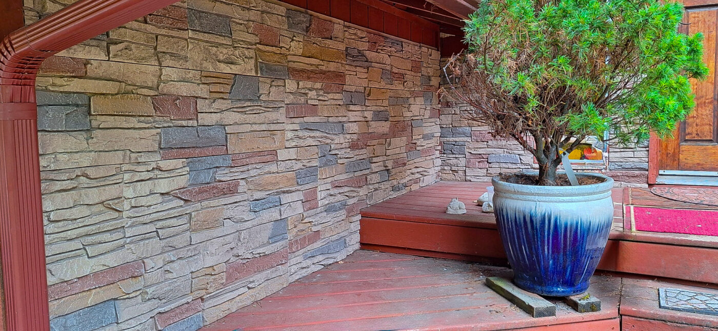 This home exterior was improved with the help of GenStone's Desert Sunrise Stacked Stone panels, giving the home a beautiful multi color stone siding.