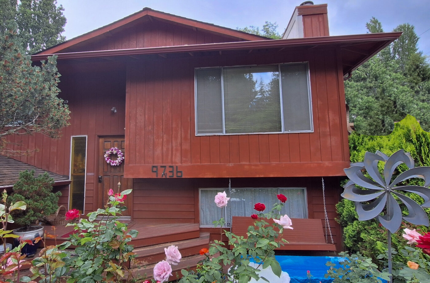 This is a home exterior before the owner completed a multi color stone siding project with GenStone's Stacked Stone panels.
